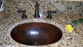 hammered copper bathroom sink after 2 years of use
